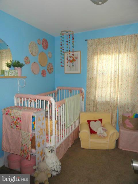 403 Paradise Road Riva, MD 21140 - Photo 21 of 22 a view of a bedroom with furniture and toys