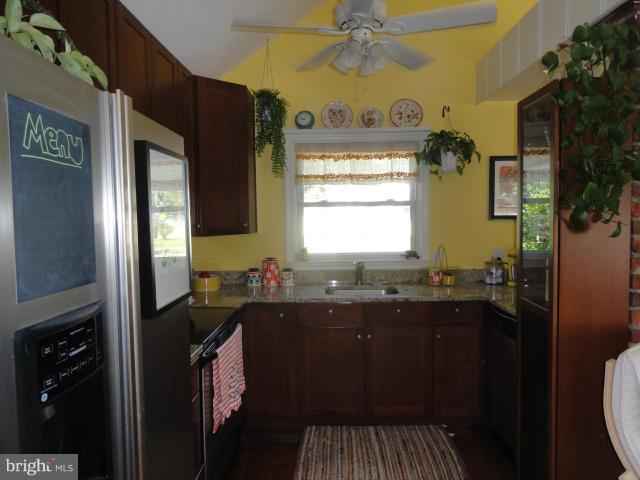 403 Paradise Road Riva, MD 21140 - Photo 8 of 22 a kitchen with a sink stove and refrigerator