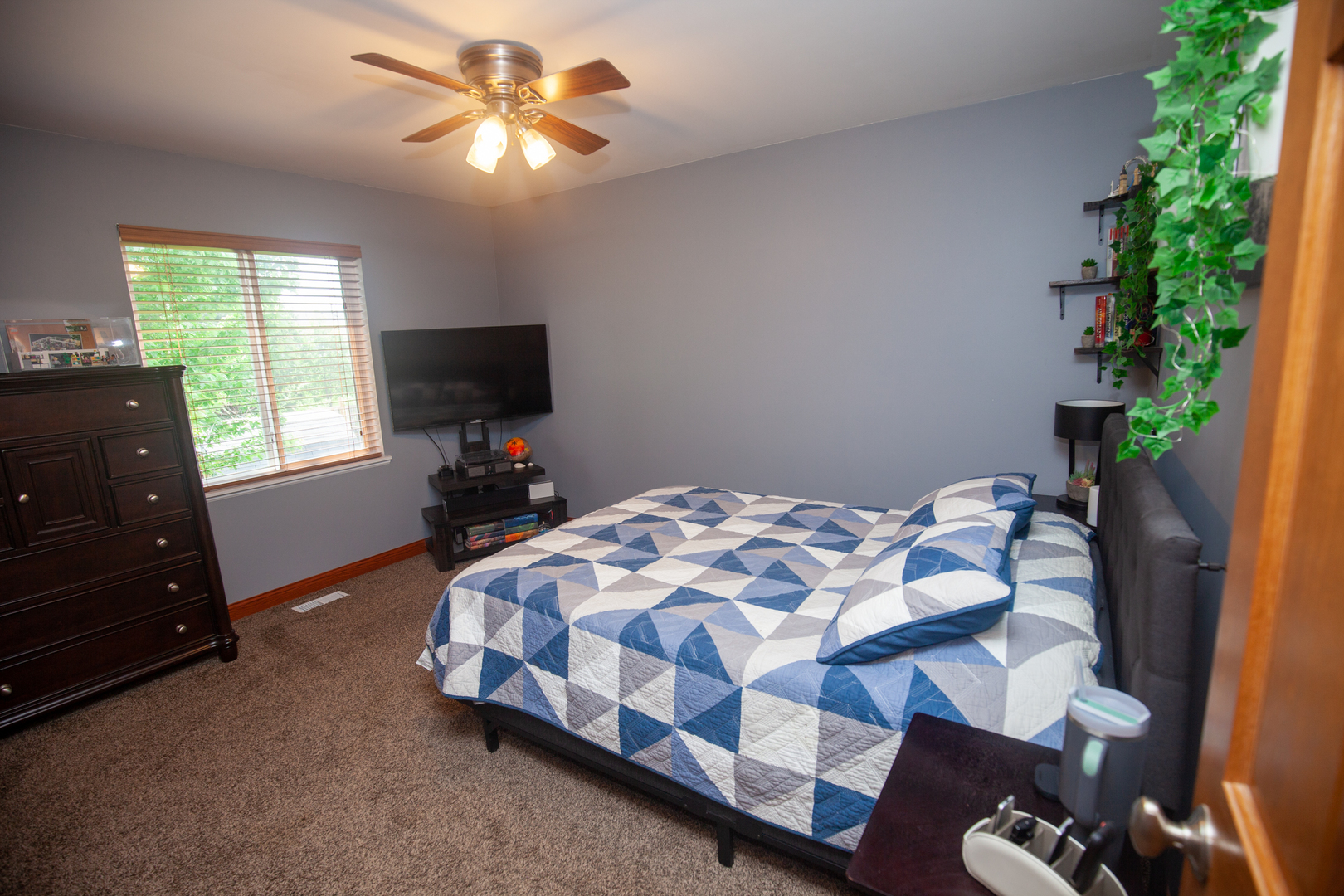613 Cartwright Trail McHenry, IL 60050 - Photo 15 of 23 a bedroom with a bed and a tv