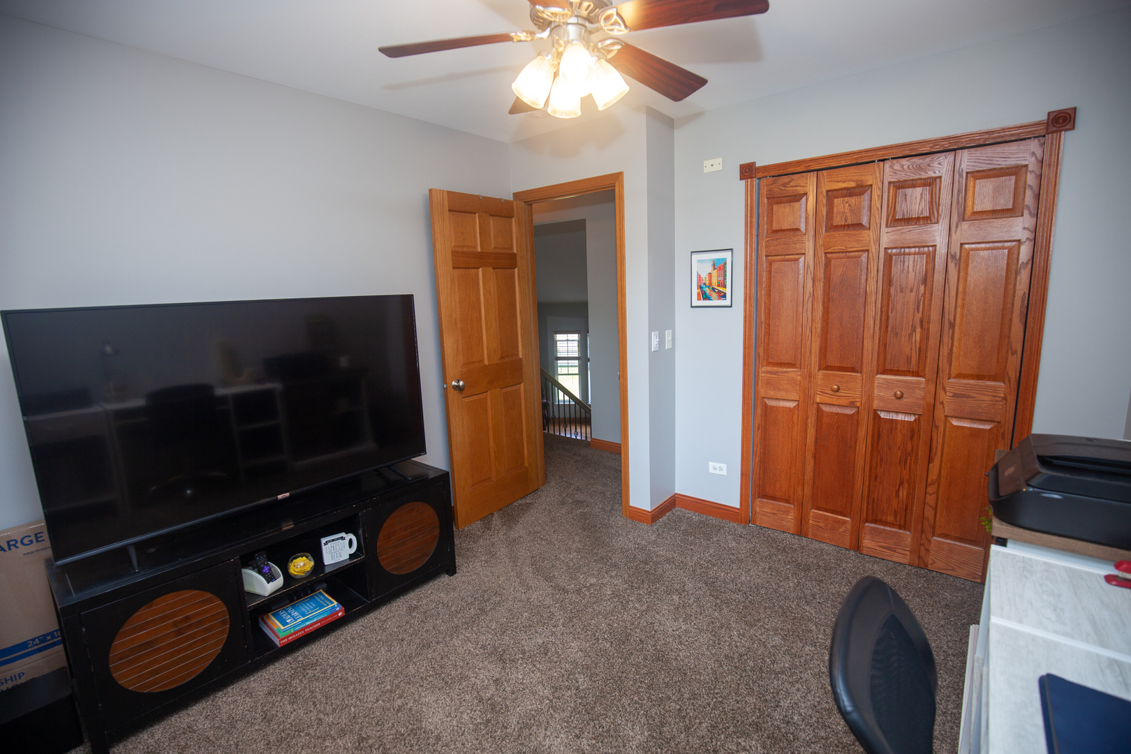 613 Cartwright Trail McHenry, IL 60050 - Photo 16 of 23 a living room with furniture a flat screen tv and a fireplace