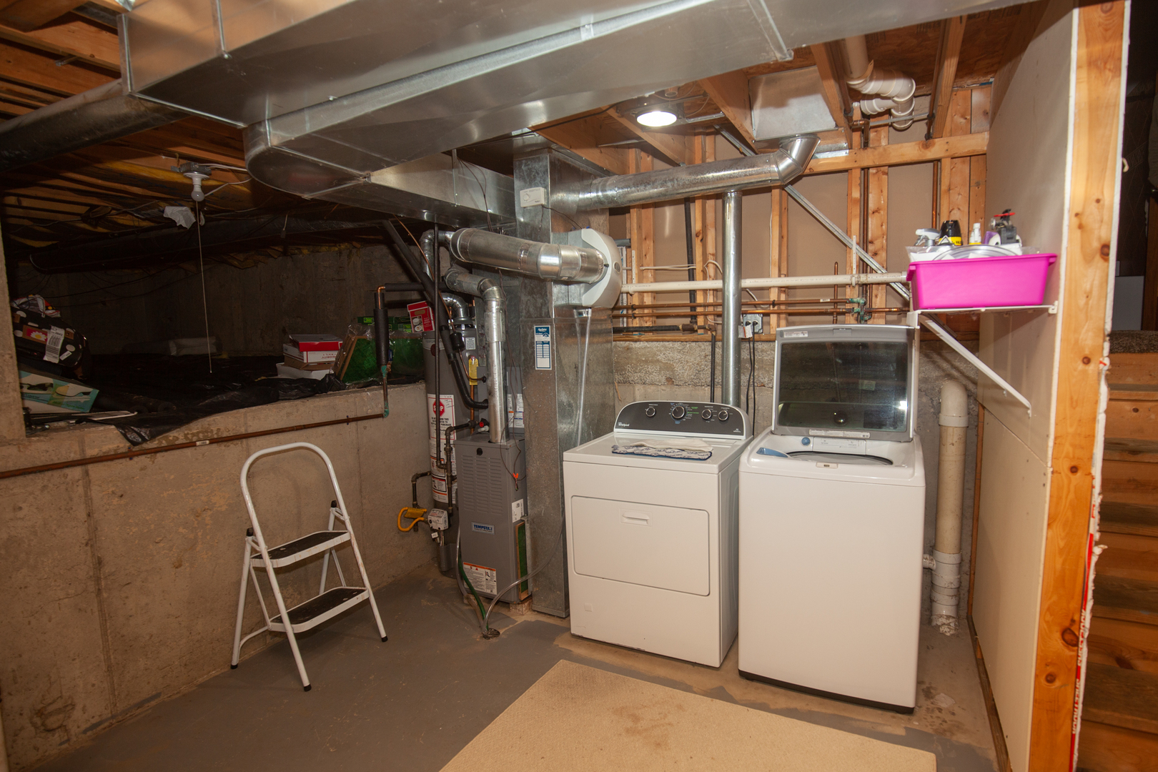 613 Cartwright Trail McHenry, IL 60050 - Photo 20 of 23 a view of a storage room with washer and dryer