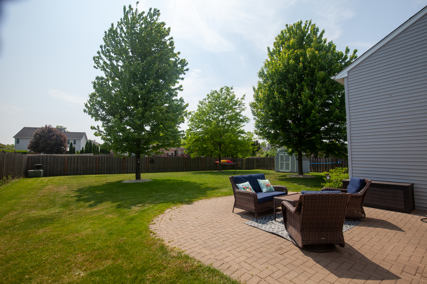 613 Cartwright Trail McHenry, IL 60050 - Photo 21 of 23 a view of a patio with couches chairs and a yard