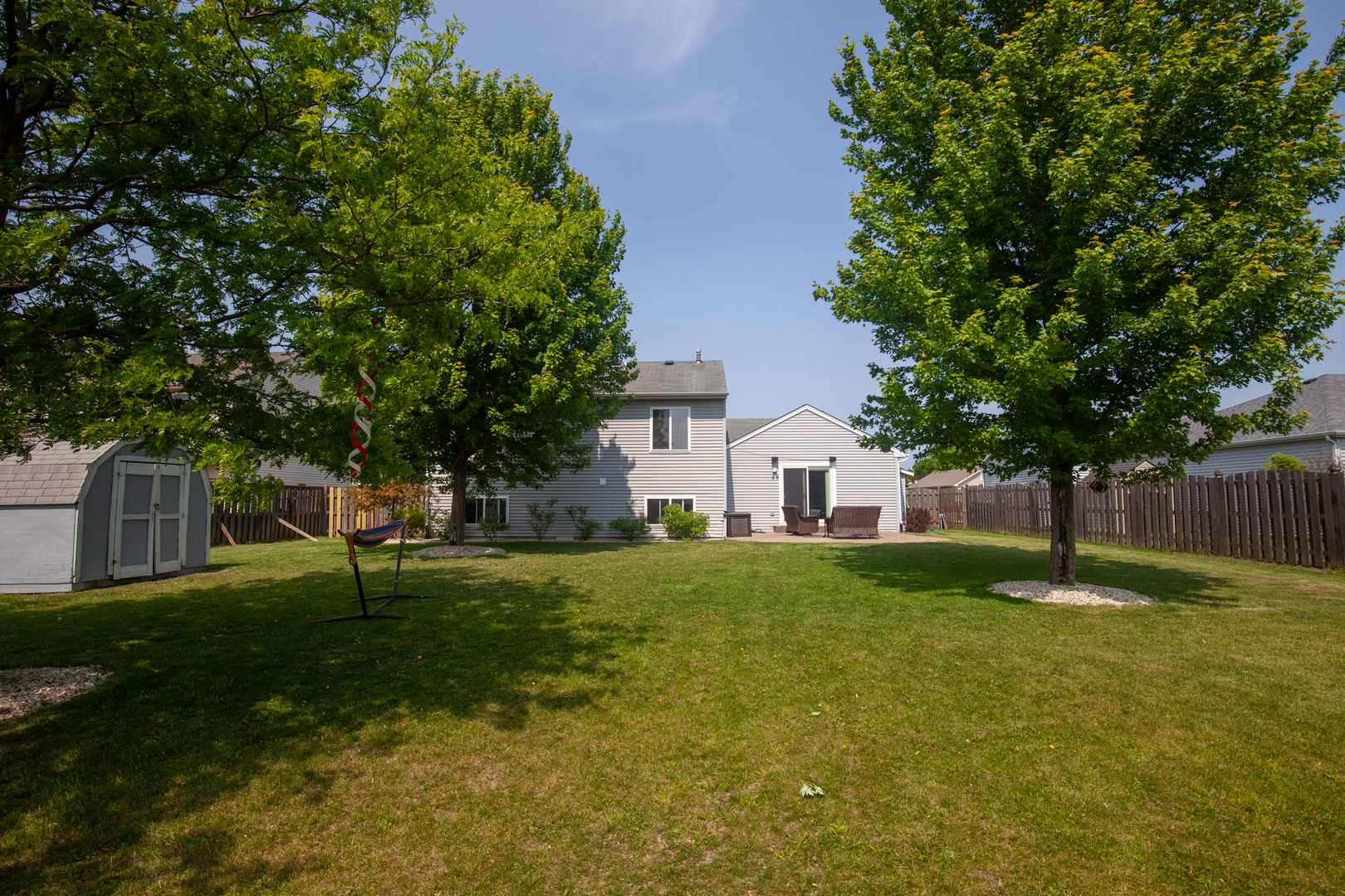 613 Cartwright Trail McHenry, IL 60050 - Photo 23 of 23 a backyard of a house with lots of green space