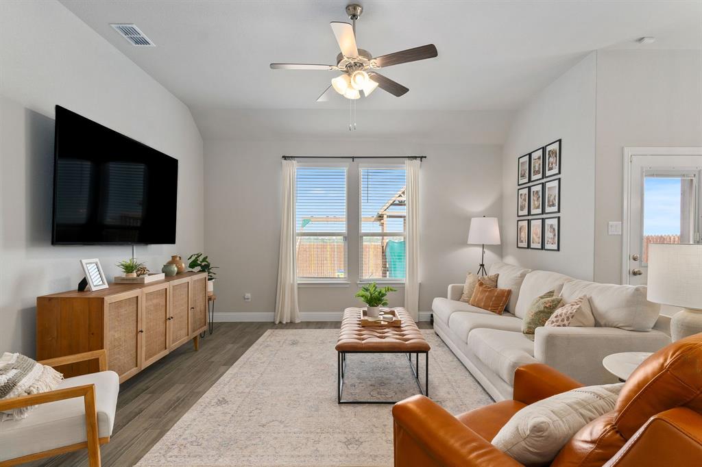 1125 Knightsbridge Road Argyle, TX 76226 - Photo 6 of 27 a living room with furniture and a flat screen tv