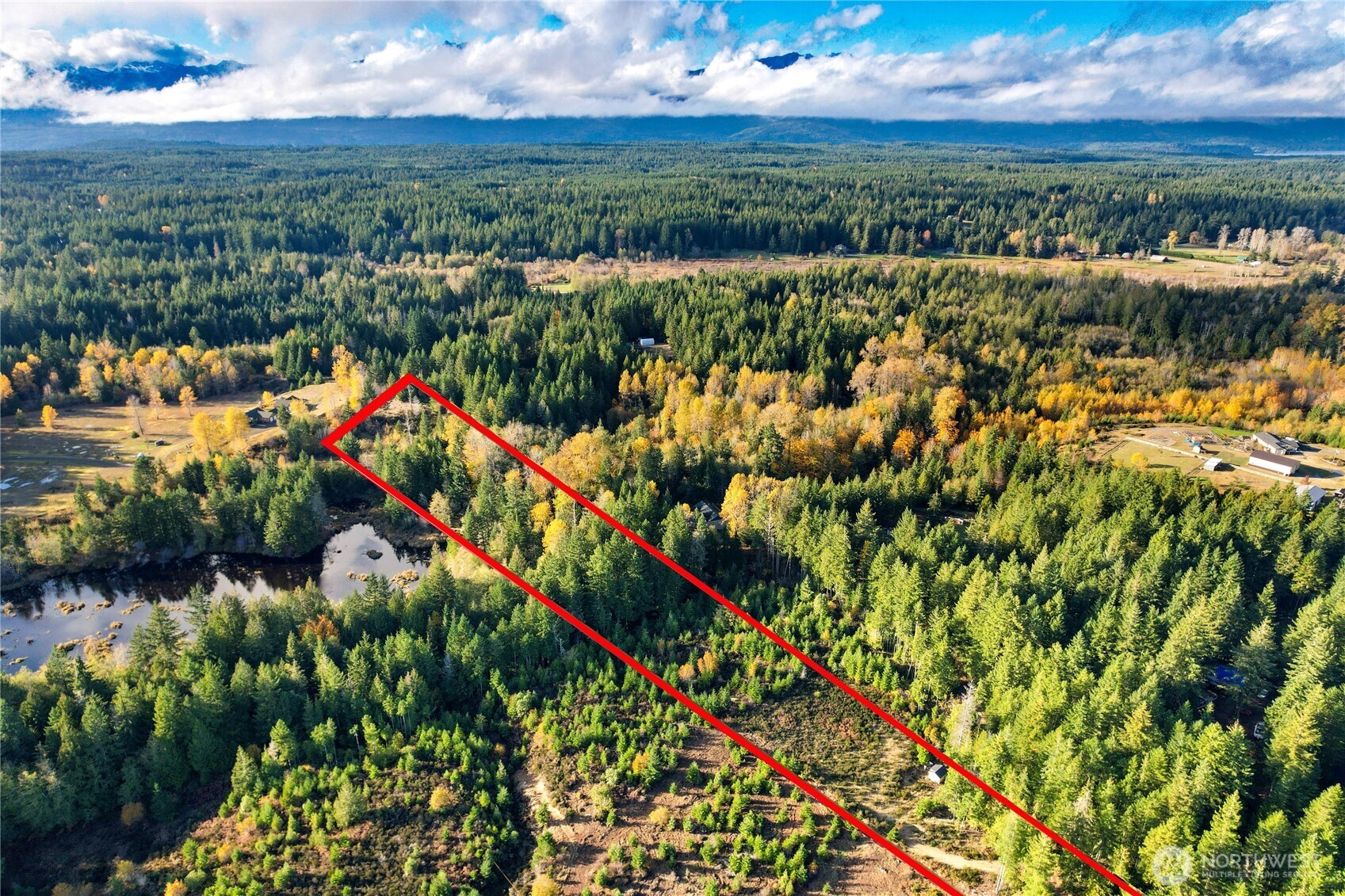 63 Wayne Road West Seabeck, WA 98380 - Photo 4 of 22 an aerial view of a houses with city view