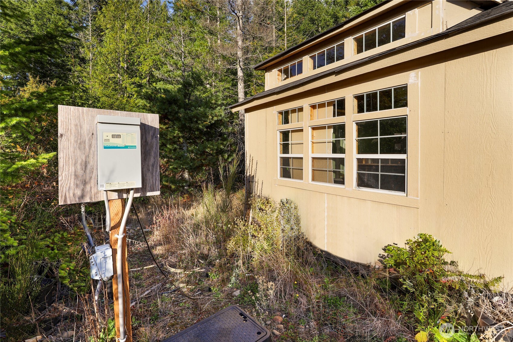 63 Wayne Road West Seabeck, WA 98380 - Photo 10 of 22 a front view of a house with a yard
