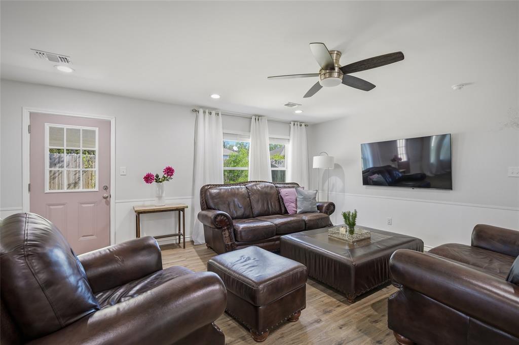 105 Thode Street Whitesboro, TX 76273 - Photo 12 of 28 a living room with furniture and a flat screen tv