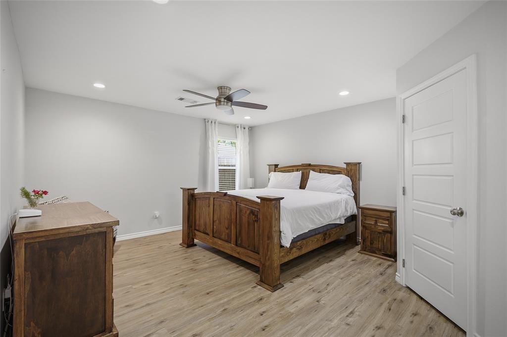 105 Thode Street Whitesboro, TX 76273 - Photo 15 of 28 a bedroom with a bed and a dresser