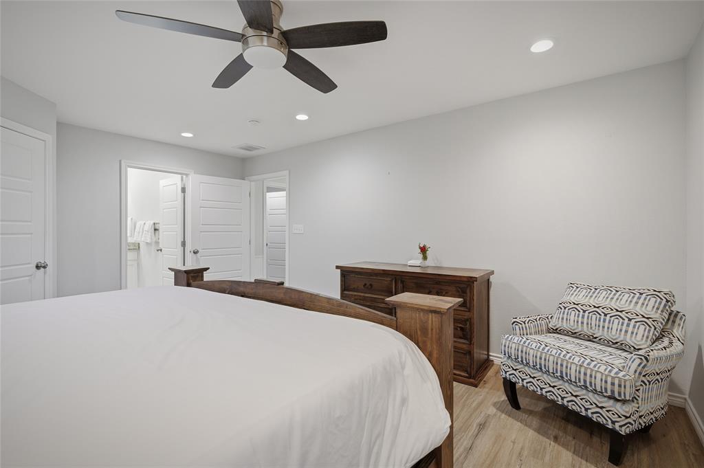 105 Thode Street Whitesboro, TX 76273 - Photo 16 of 28 a bedroom with a bed and a ceiling fan