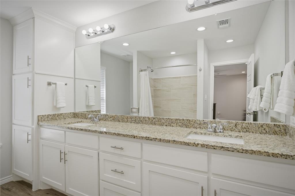 105 Thode Street Whitesboro, TX 76273 - Photo 17 of 28 a bathroom with a granite countertop sink double and mirror