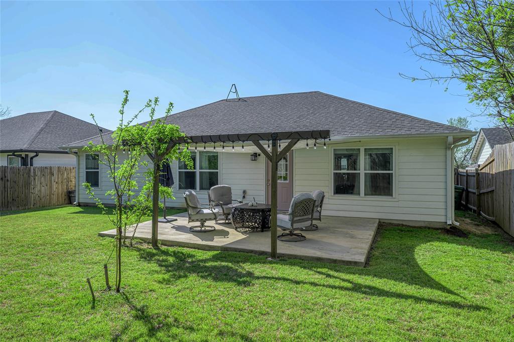 105 Thode Street Whitesboro, TX 76273 - Photo 23 of 28 a garden view with a seating space