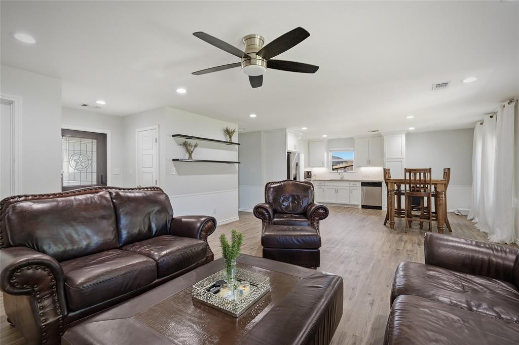 105 Thode Street Whitesboro, TX 76273 - Photo 27 of 28 a living room with furniture kitchen view and a table