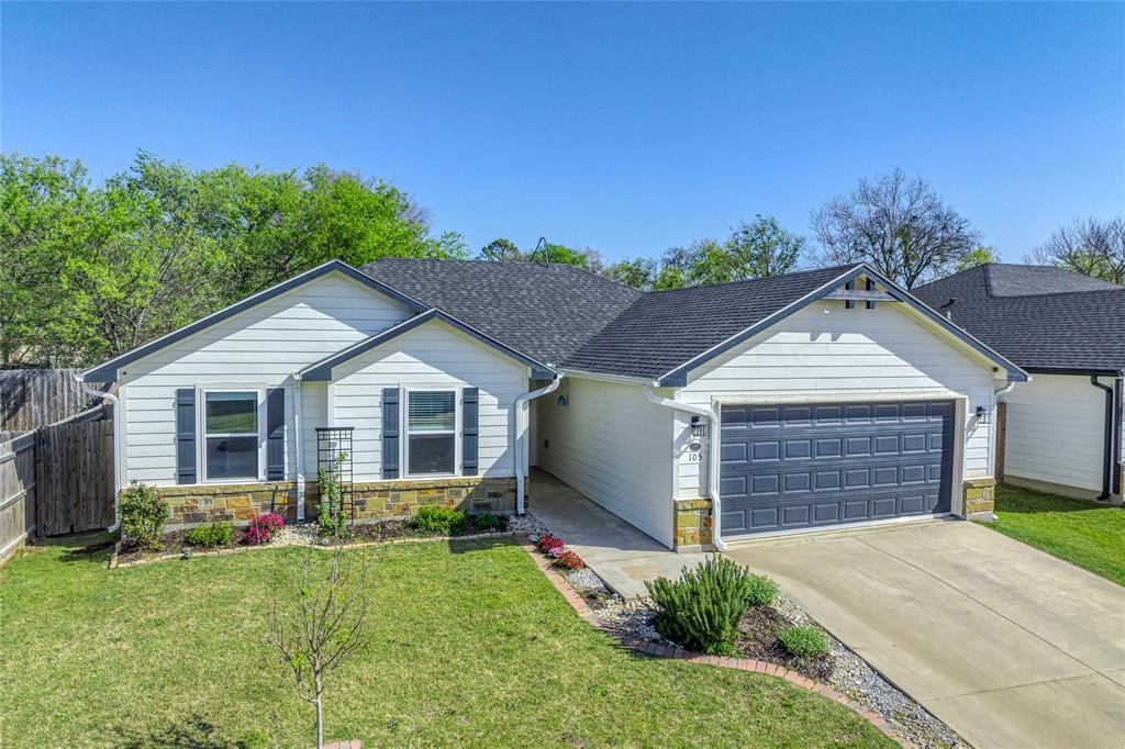 105 Thode Street Whitesboro, TX 76273 - Photo 6 of 28 a front view of a house with yard