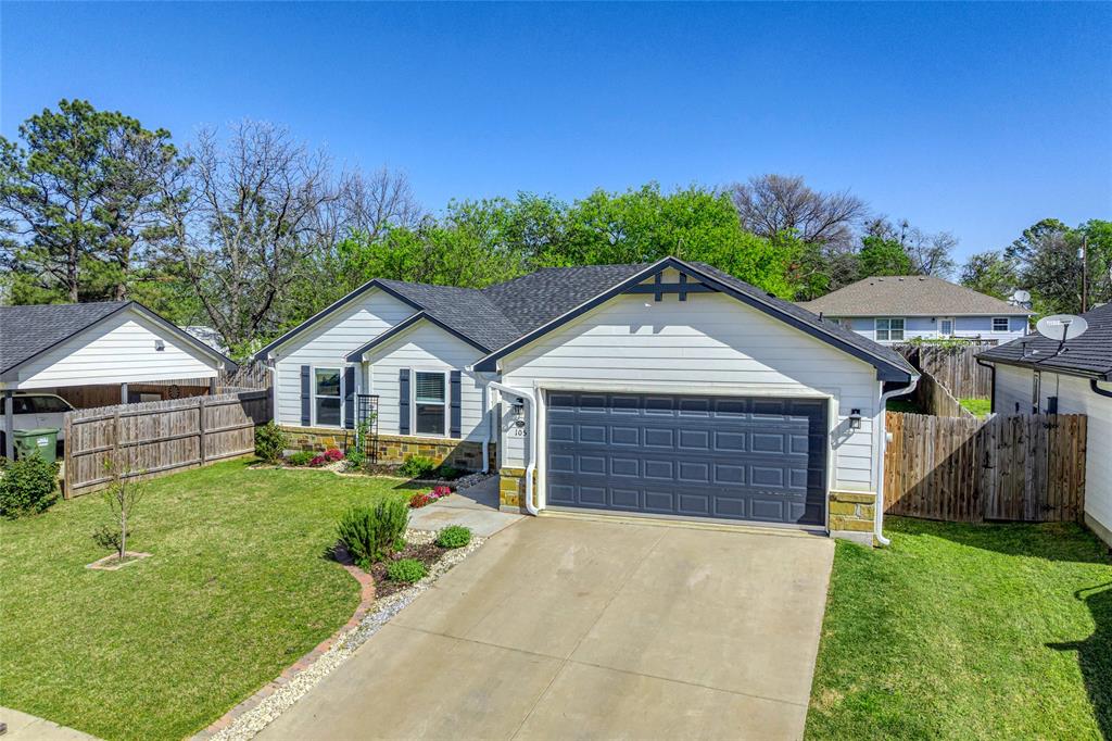 105 Thode Street Whitesboro, TX 76273 - Photo 7 of 28 front view of a house with a yard