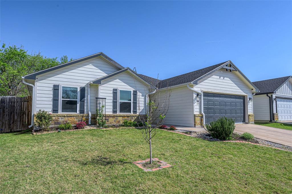 105 Thode Street Whitesboro, TX 76273 - Photo 8 of 28 a view of a house with backyard and garden