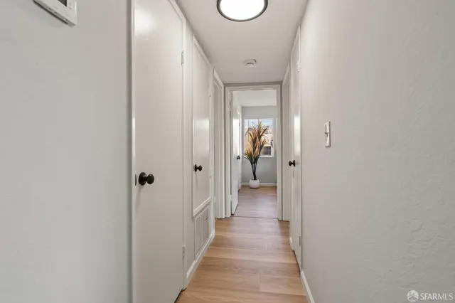 a view of a bathroom from the hallway