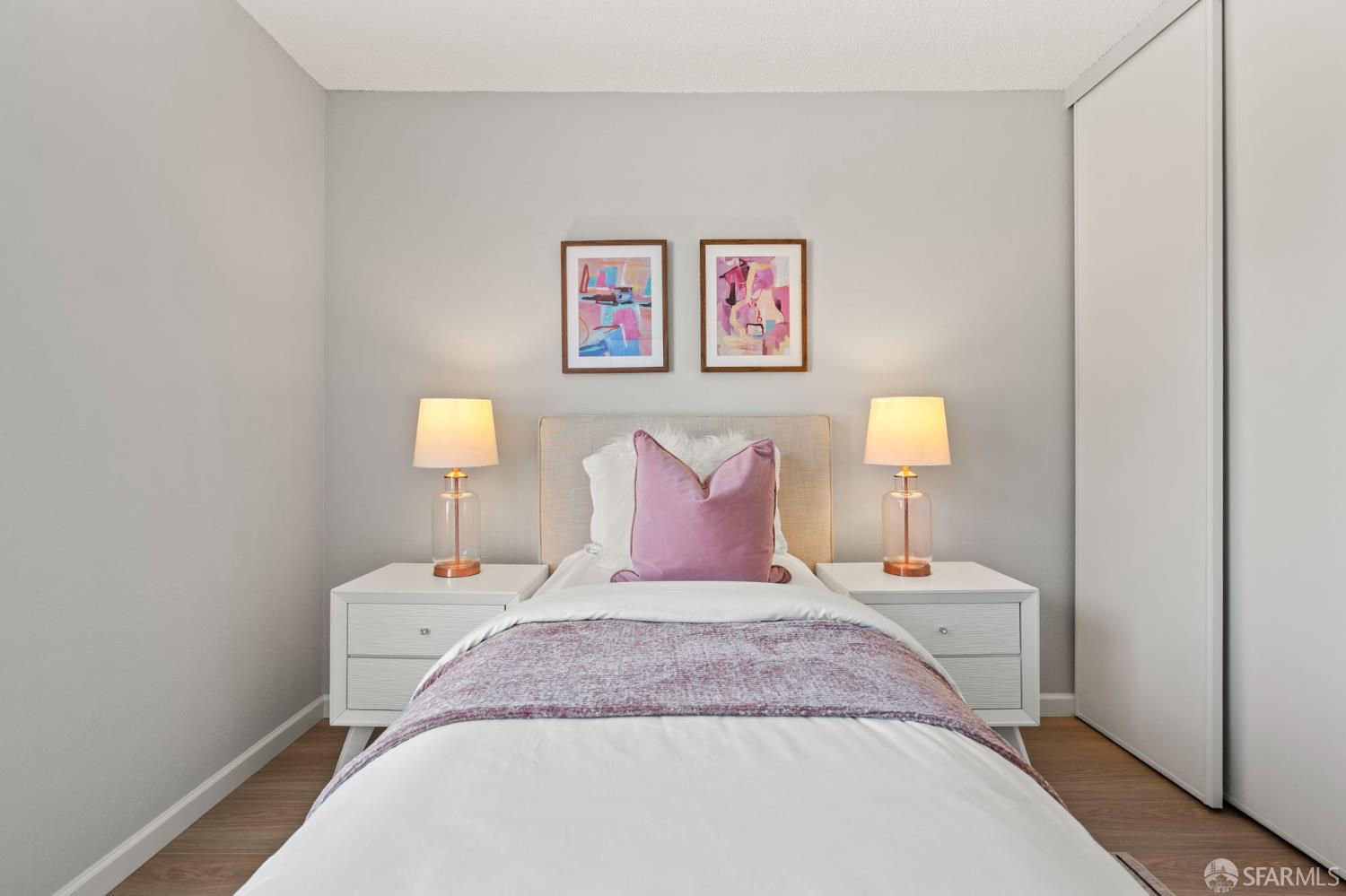 5319 Ridgeview Circle, Unit 10 El Sobrante, CA 94803 - Photo 18 of 26 a bedroom with a bed and a lamp on table