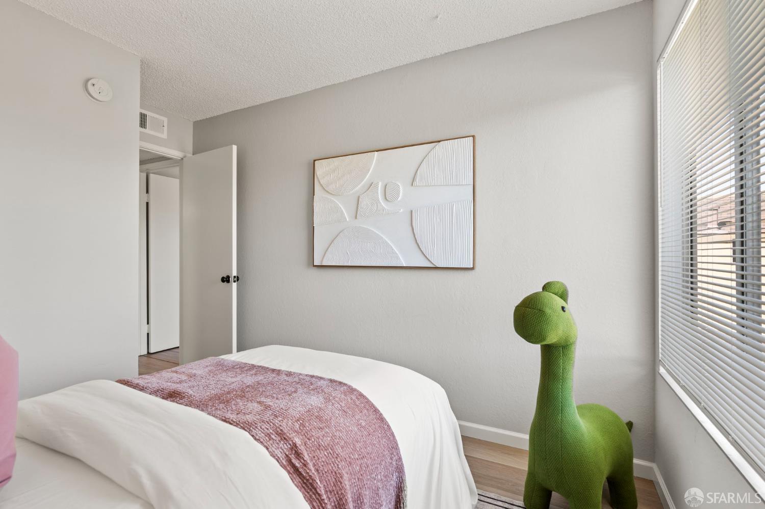 5319 Ridgeview Circle, Unit 10 El Sobrante, CA 94803 - Photo 19 of 26 a bedroom with a bed and a window