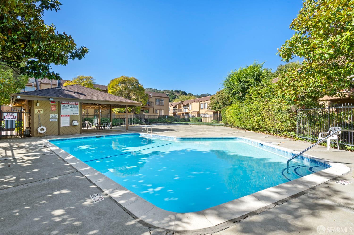 5319 Ridgeview Circle, Unit 10 El Sobrante, CA 94803 - Photo 23 of 26 a view of a patio with swimming pool