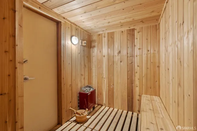 a bathroom with a shower and a curtain