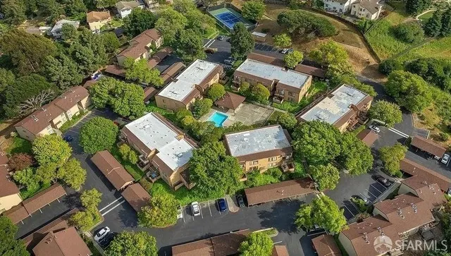 an aerial view of residential house with outdoor space and parking
