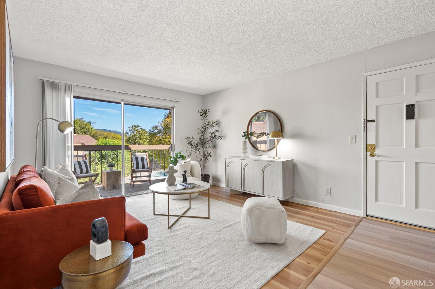 5319 Ridgeview Circle, Unit 10 El Sobrante, CA 94803 - Photo 4 of 26 a living room with furniture and a floor to ceiling window