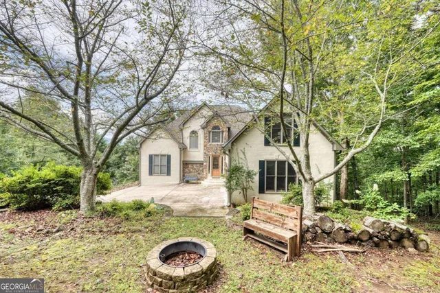 a living room with furniture and a ceiling fan