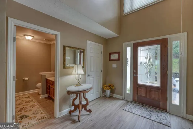 a view of a dining room with furniture window and wooden floor
