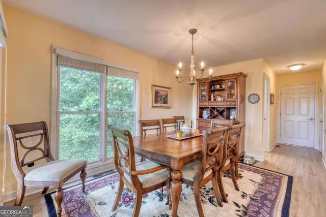 a bathroom with bathtub and window