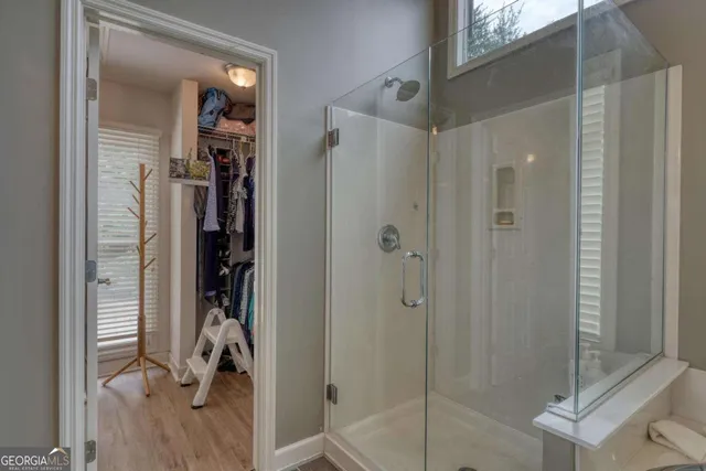 a bedroom with furniture and a flat screen tv