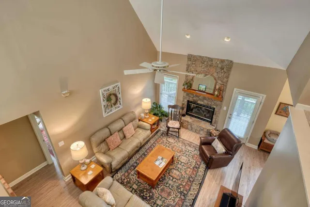 a spacious bedroom with a bed and a flat screen tv