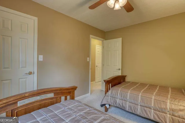 a living room with furniture rug and wooden floor