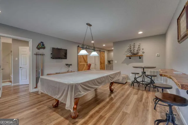 a view of balcony with furniture and wooden deck