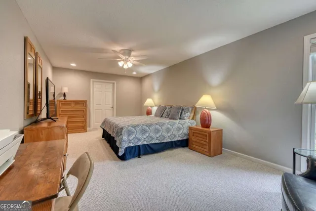 a view of a two room with wooden floor and outdoor seating