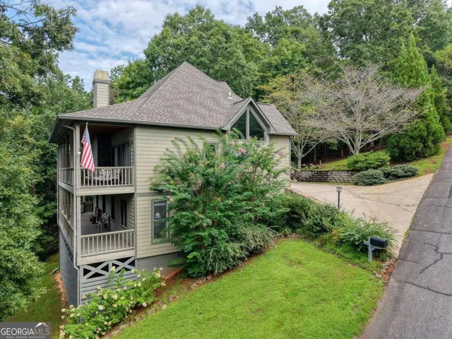 a view of front door of house with outdoor seating