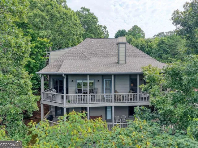 a large kitchen with lots of counter top space and stainless steel appliances