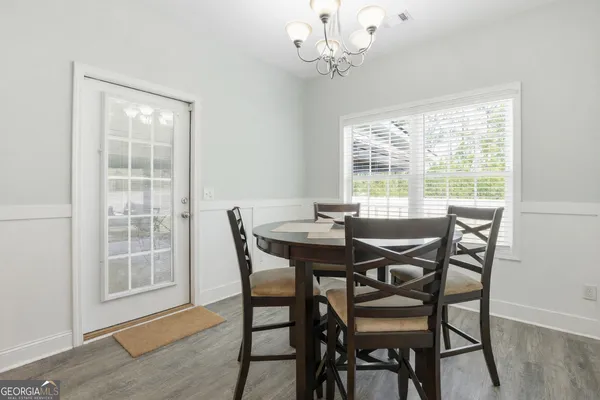 a view of a dining room with furniture window and outside view