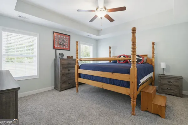 a bedroom with furniture and window