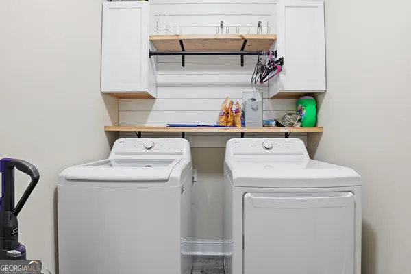 a utility room with dryer and washer