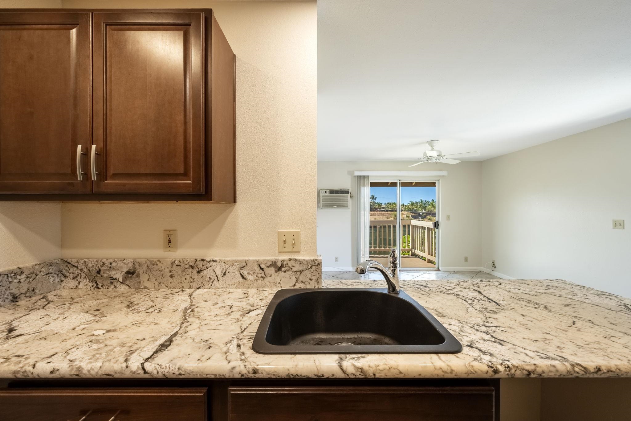 480 Kenolio Road, Unit 31205 Kihei, HI 96753 - Photo 13 of 45 a bedroom with a bed and a window