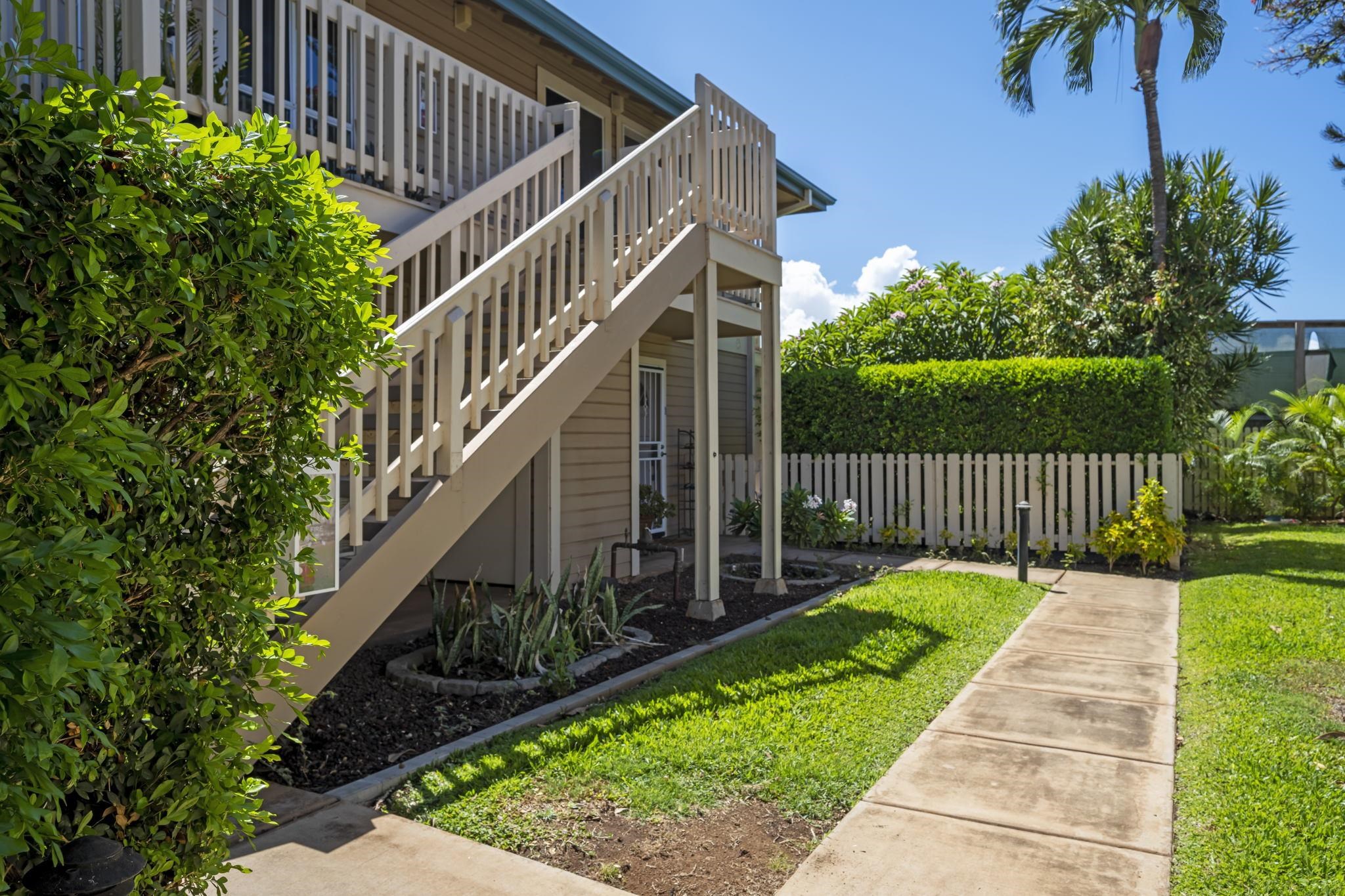 480 Kenolio Road, Unit 31205 Kihei, HI 96753 - Photo 2 of 45 a view of a house with backyard and wooden fence