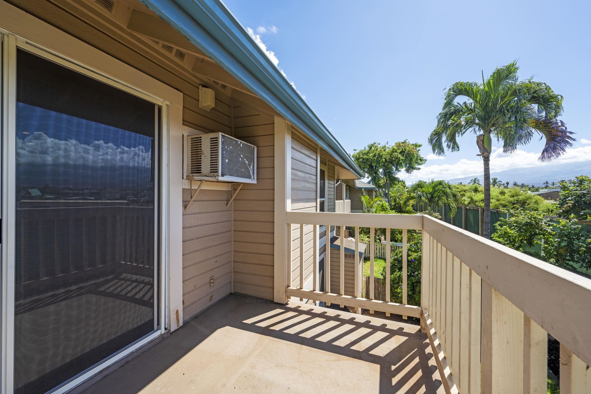 480 Kenolio Road, Unit 31205 Kihei, HI 96753 - Photo 21 of 45 a view of a balcony with wooden floor