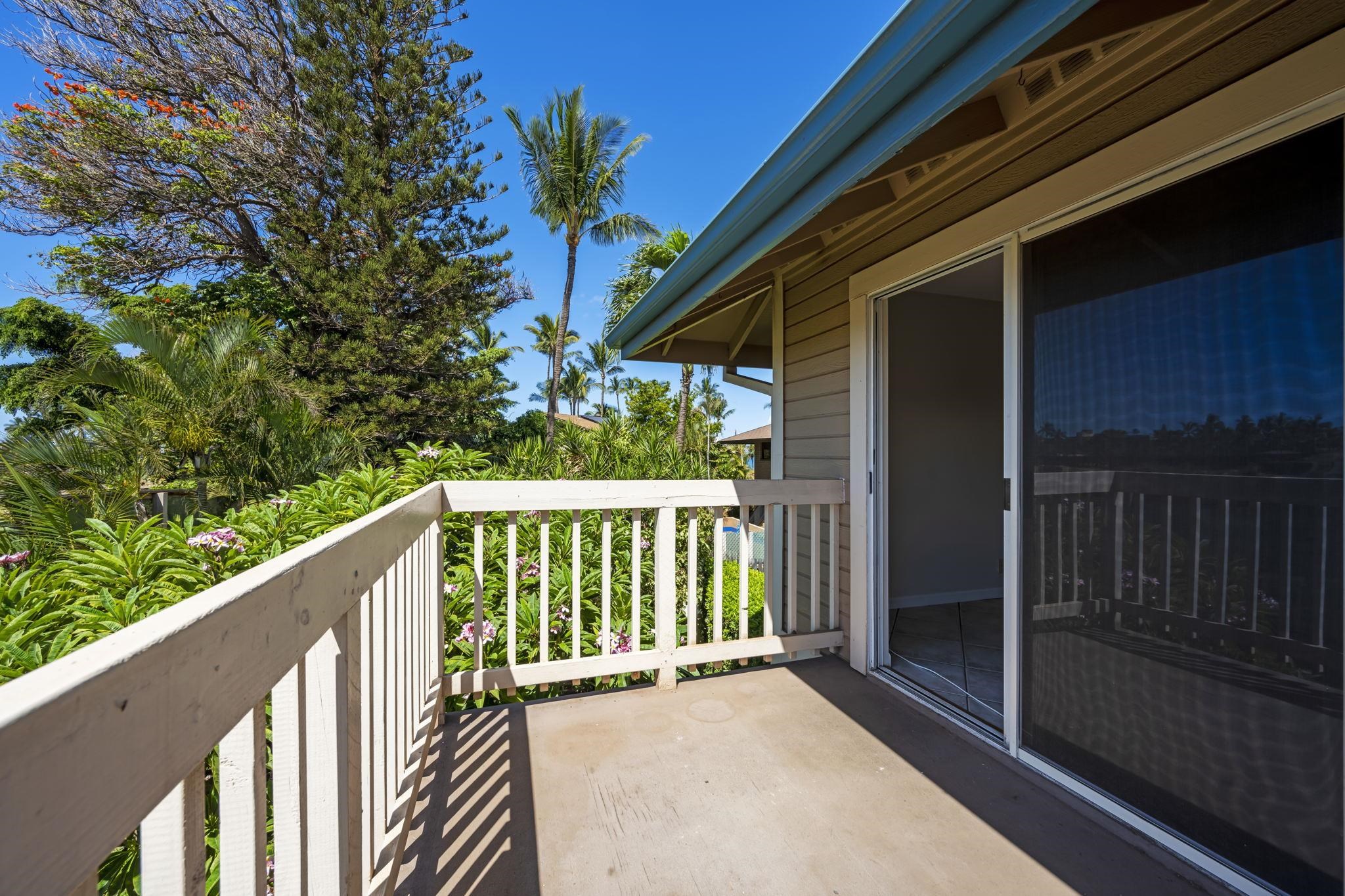 480 Kenolio Road, Unit 31205 Kihei, HI 96753 - Photo 23 of 45 a balcony with wooden floor and outdoor space