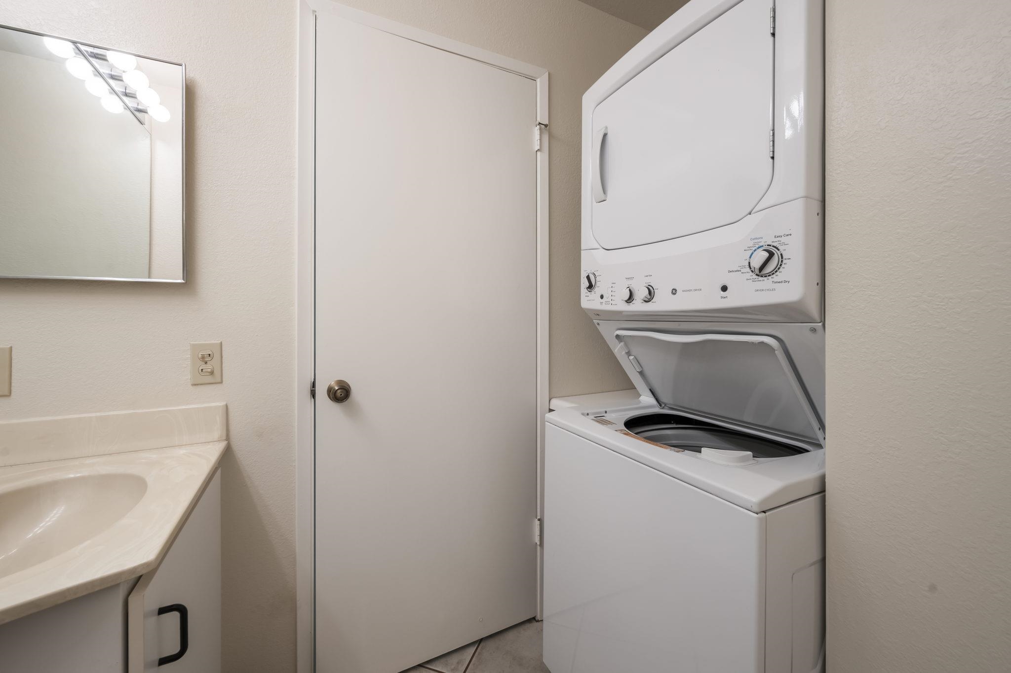 480 Kenolio Road, Unit 31205 Kihei, HI 96753 - Photo 30 of 45 a bathroom with a toilet sink and mirror