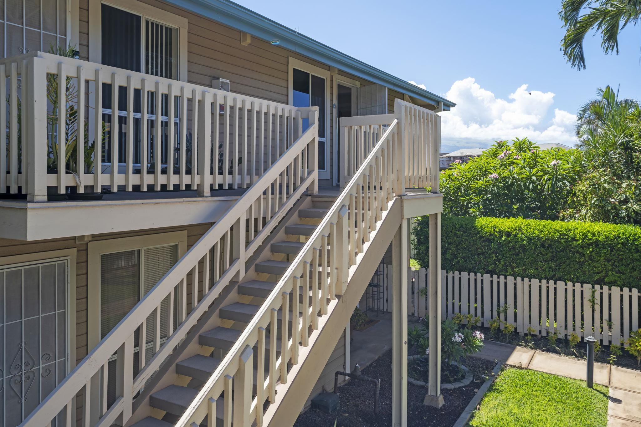 480 Kenolio Road, Unit 31205 Kihei, HI 96753 - Photo 3 of 45 a view of staircase with railing and a small yard