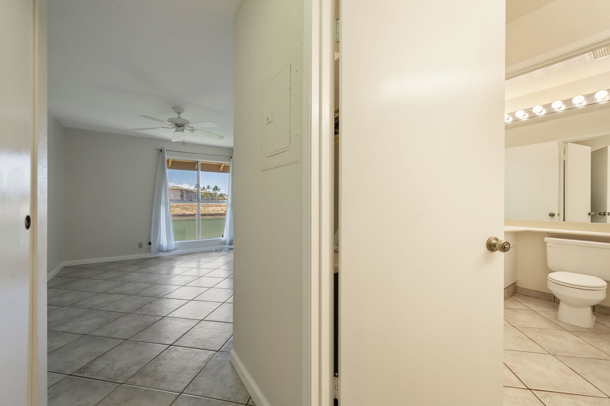 480 Kenolio Road, Unit 31205 Kihei, HI 96753 - Photo 32 of 45 a bathroom with a sink and a toilet
