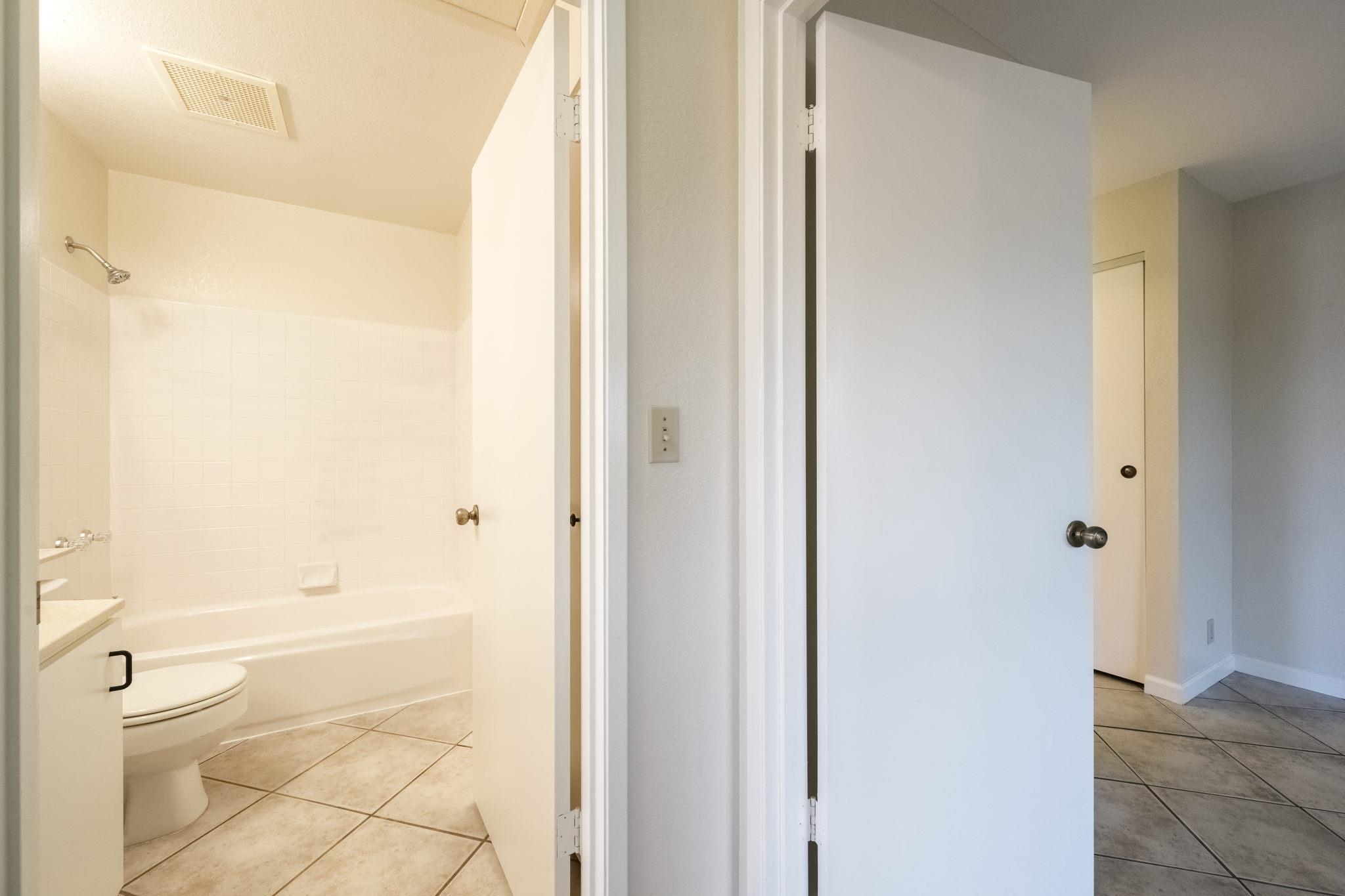 480 Kenolio Road, Unit 31205 Kihei, HI 96753 - Photo 34 of 45 a bathroom with a granite countertop shower and a toilet