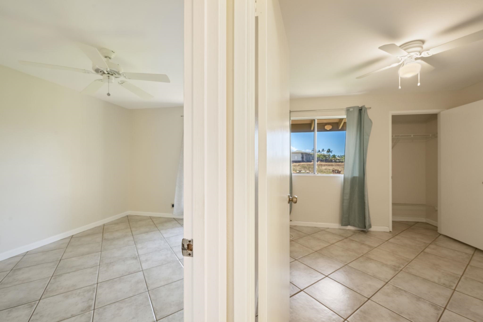 480 Kenolio Road, Unit 31205 Kihei, HI 96753 - Photo 35 of 45 an empty room with closet and a chandelier fan