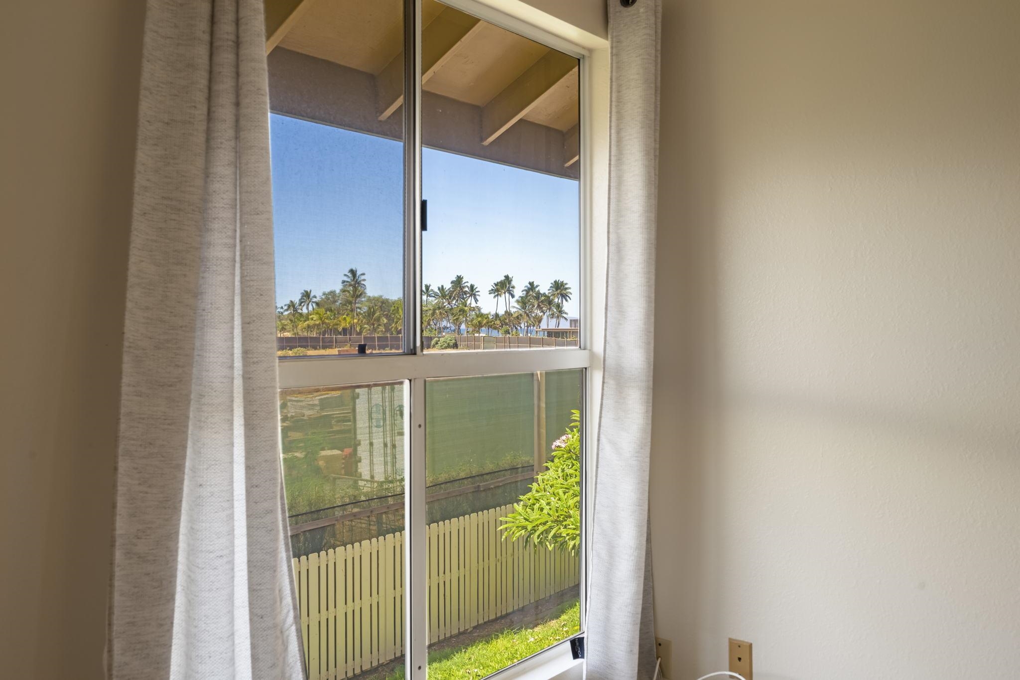 480 Kenolio Road, Unit 31205 Kihei, HI 96753 - Photo 41 of 45 a bathroom with a glass door