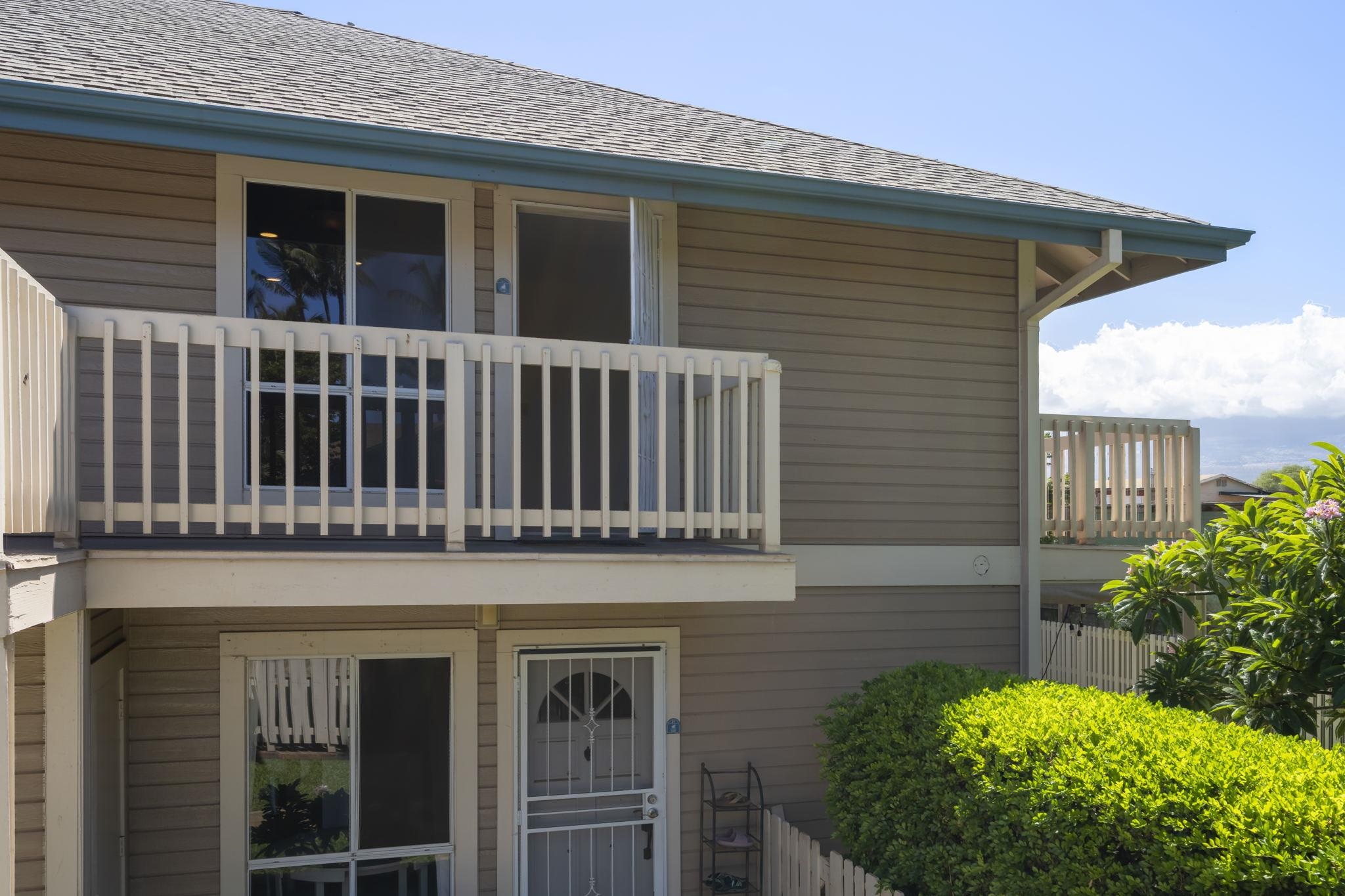 480 Kenolio Road, Unit 31205 Kihei, HI 96753 - Photo 5 of 45 a view of a house with a small yard and plants